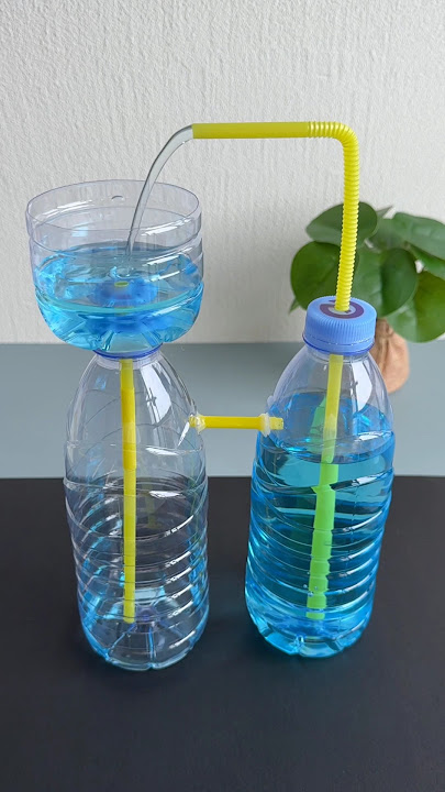 Water fountain made using two plastic bottles and straw#recycledcraft #handmadediy #parentchildcraft