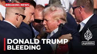 Former President Donald Trump Bleeding After What Sounded Like Gunshots