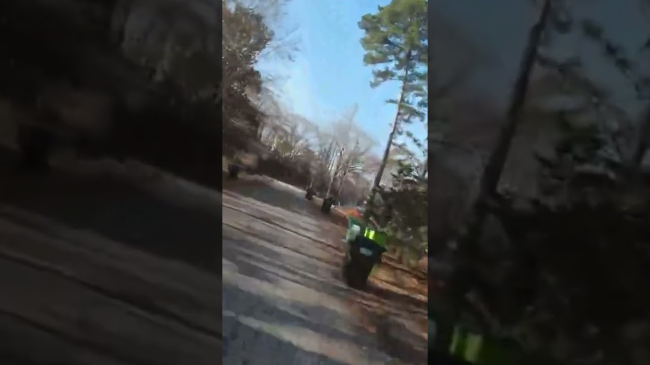 Racing drone going 60 mile an hour down neighborhood roads