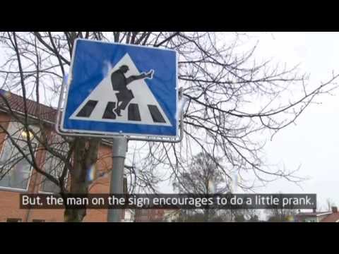 Traffic sign makes people do the Monty Python Silly Walk