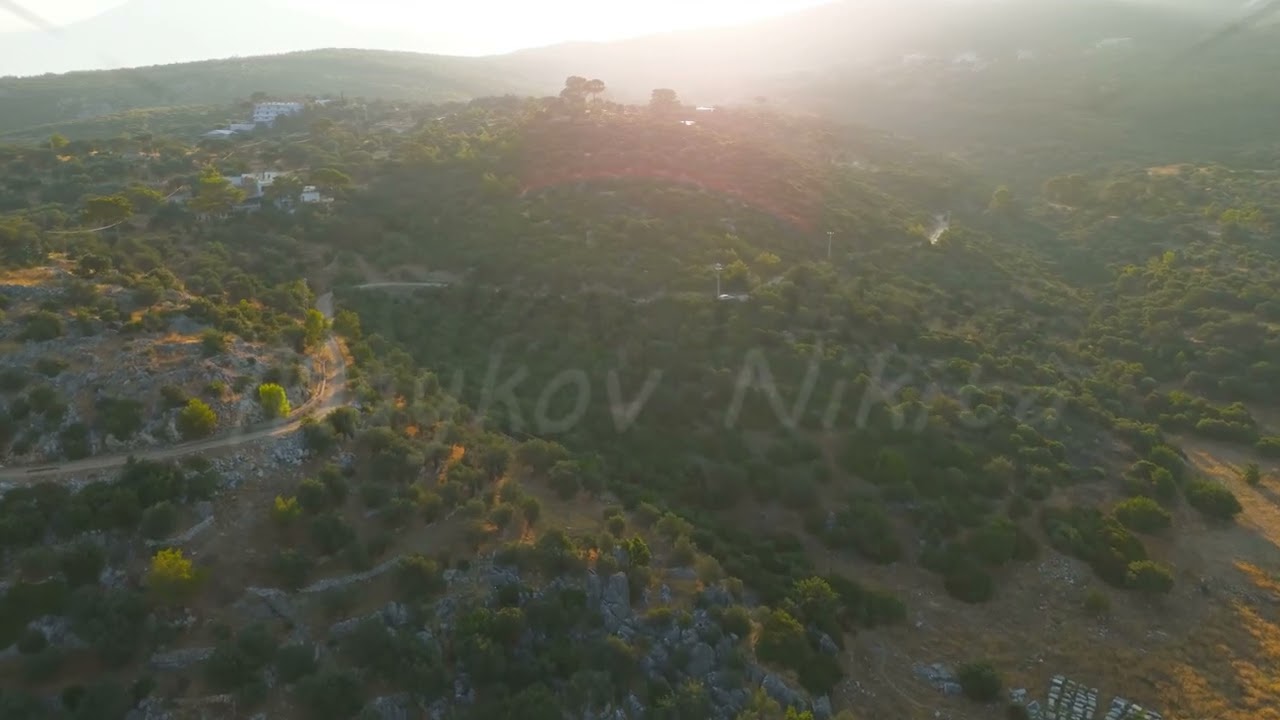 Gelemis, Turkey. Wooded hills surrounding Patara ancient city in morning backlight, sunrise over ...