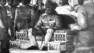 Jaipur Maharajah Sawai Man Singh II sits on his throne and bestows blessings on p...HD Stock Footage