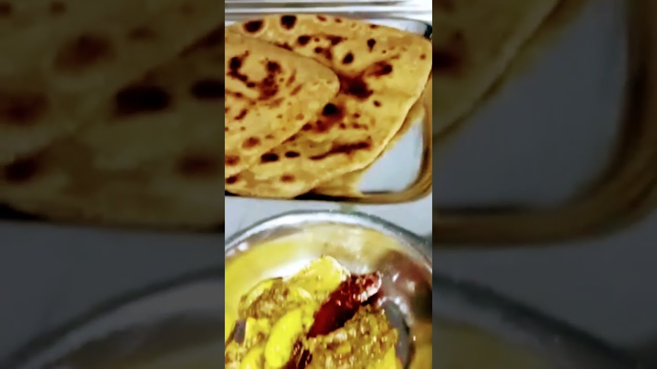 full plate, simple Paratha , vegetable gravy,mango pickle, jackfruit pickle,food 