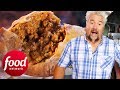 Guy Fieri Can't Get Enough Of This Spicy Sausage Meat Pie! | Diners, Drive-Ins & Dives