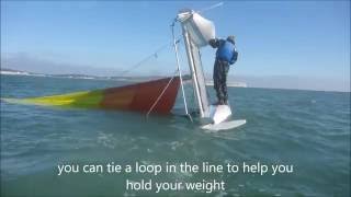 Righting an inverted catamaran