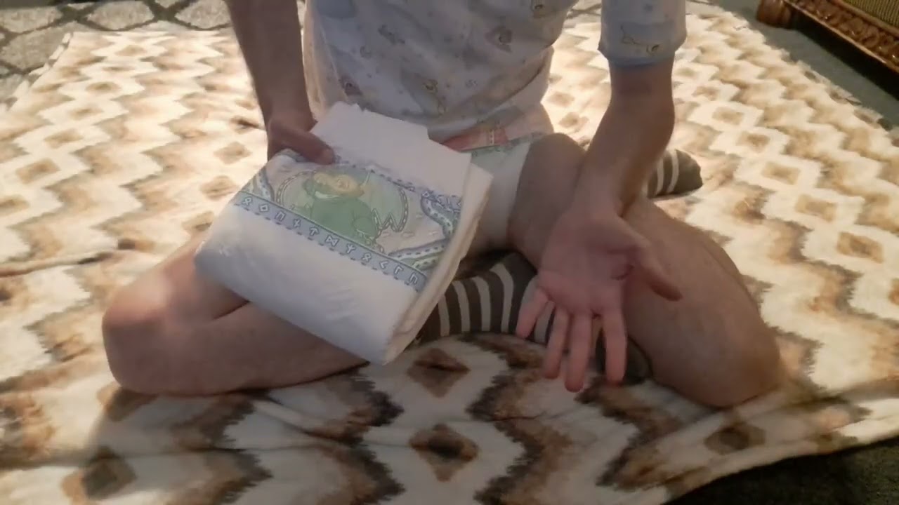 demonstration of how to put a Tykables Camelot / adult diaper change yourself while laying down