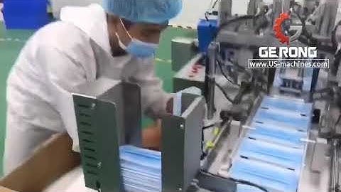 Mask ear loop welding machine with mask loading track and paging feeding system