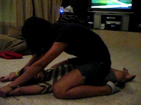 Big sis beats up little brother - YouTube
