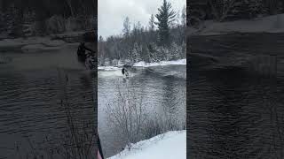 People are riding snowmobiles across the water!