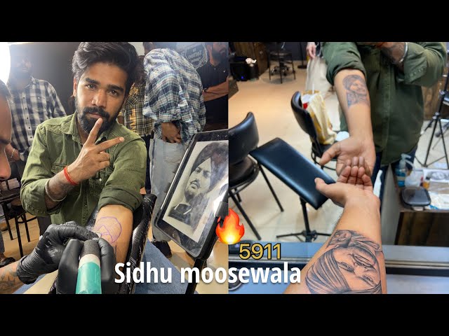 Sidhu Moose Wala's father gets son's face inked on his arm, singer's mother  inscribe 'Sarwan Putt' – India TV