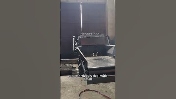 A drum chipper crushes small tree trunks #crushing #machine #crushingtime