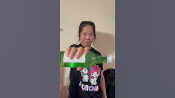 Learning how to open soju bottle 😂 #soju #koreandrink