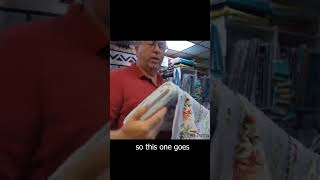 Ken shows off hummingbird border print fabric by Wilmington Prints #fabric