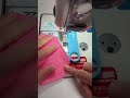 positioning, threading, enlarging, and measuring. A woman making clothes in a "garment factory".