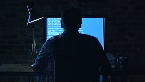 Programmer Sitting in Front of a Monitor at Night | Stock Footage - Videohive