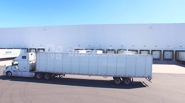 transport trucks leaving a loading dock vjuq znbe  WL