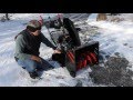 SNOWBLOWER ON A GRAVEL DRIVEWAY