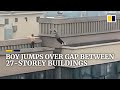 Boy jumps over gap between 27-storey buildings in China