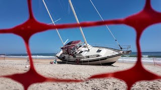 Stranded sailboat becomes tourist draw on Flagler Beach