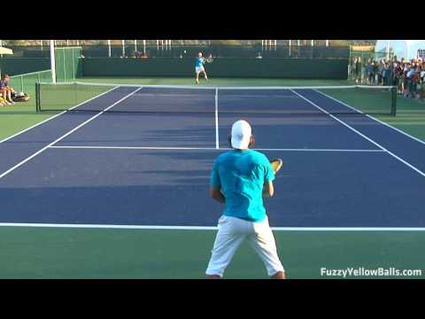 www.fuzzyyellowballs.com Rafael Nadal hitting backhands in high definition from the back perspective. This video was filmed at the BNP Paribas Open in Indian Wells, CA ( www.bnpparibasopen.org ). To learn how to hit backhands like Nadal and for more HD video, please visit http !