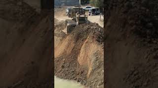 Good Dozer is currently engaged in resizing road on the opposite side of the canal