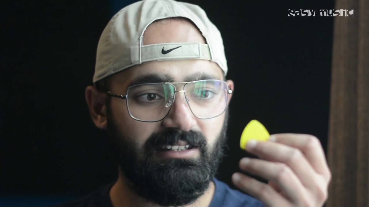 How to properly hold a Guitar Plectrum/Pick | Urdu | Hindi | Easy Music Tutorials - YouTube
