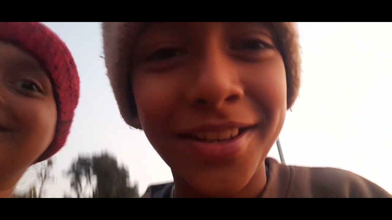 Playing with my brothers by cricket in my village