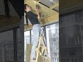 the process of installing thin, wide boards on a wooden frame ceiling in a building room #popular