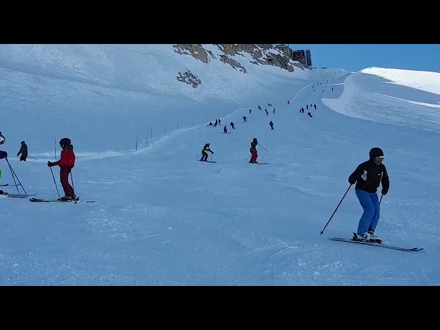 Met een visueel beperkte deelnemer de 12 km lange Marmolada afdaling skiën