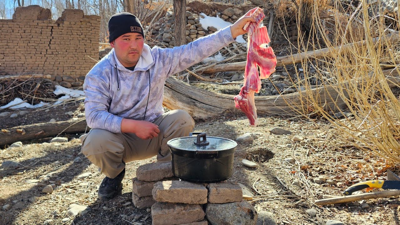 Lamb meat cooked in the heart of nature, over an open fire and in the fresh open air