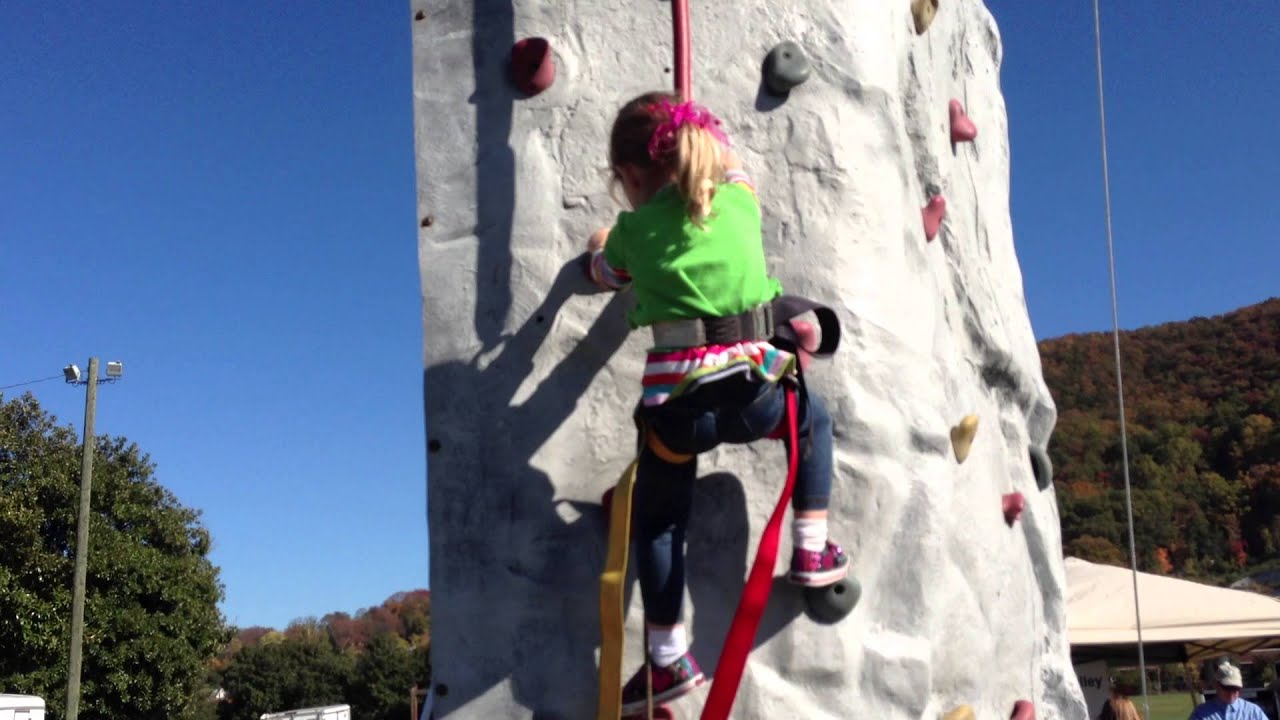 Katie climbing the rock wall. YouTube