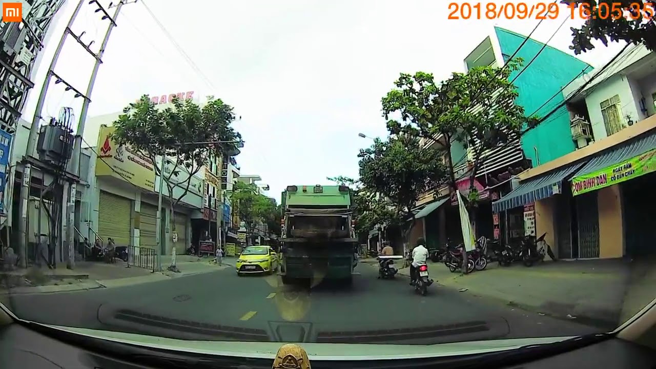 The guy using handphone when driving a motobike - Traffic in Vietnam