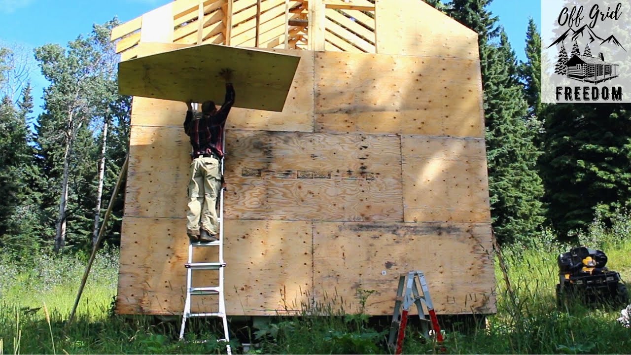 Sheeting the Off Grid Cabin Walls in Northern Canada | SOLO Build - YouTube