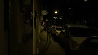 Drunk guy gets on top of friends shoulders and attempts to touch sign