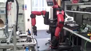 Baxter robot showing a red card and yellow card (football/soccer)