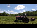 Farmall M mowing first cut hay