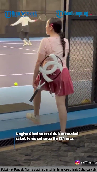WEARING A SHORT SKIRTS, NAGITA SLAVINA RELAXES CARRYING A TENNIS RACKET THAT IS THE PRICE OF A CAR