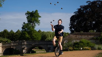 World Record for 7 Balls Juggled While Riding a Unicycle!