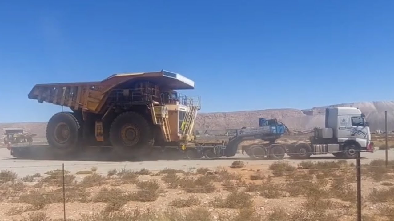 Multi-axle Self Propelled Hydraulic Modular Low Bed delivers a Belaz 220 Ton Dump Truck