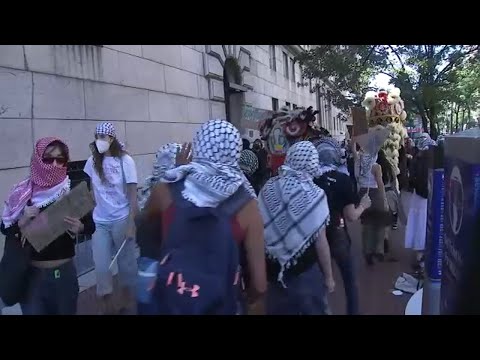 Demonstrators protest outside