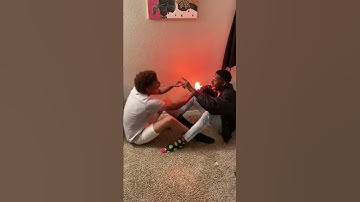 Two Guys light a Bulb with their Feet