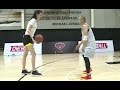 Tall Woman Plays Basketball with Shorter Guy