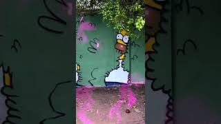 Homer Simpson fading into the bushes meme mural Homer Simpson fading into the bushes meme mural