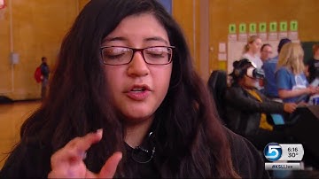 Students try out a virtual reality simulator to learn the dangers of texting while driving