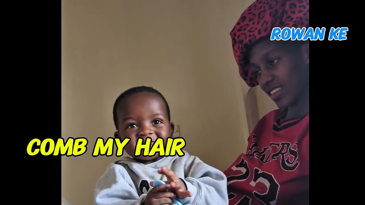 An African child combs his hair for the first time today. Rowan's Milestones 