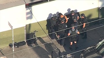 Gunman arrested after Los Angeles store hostage standoff