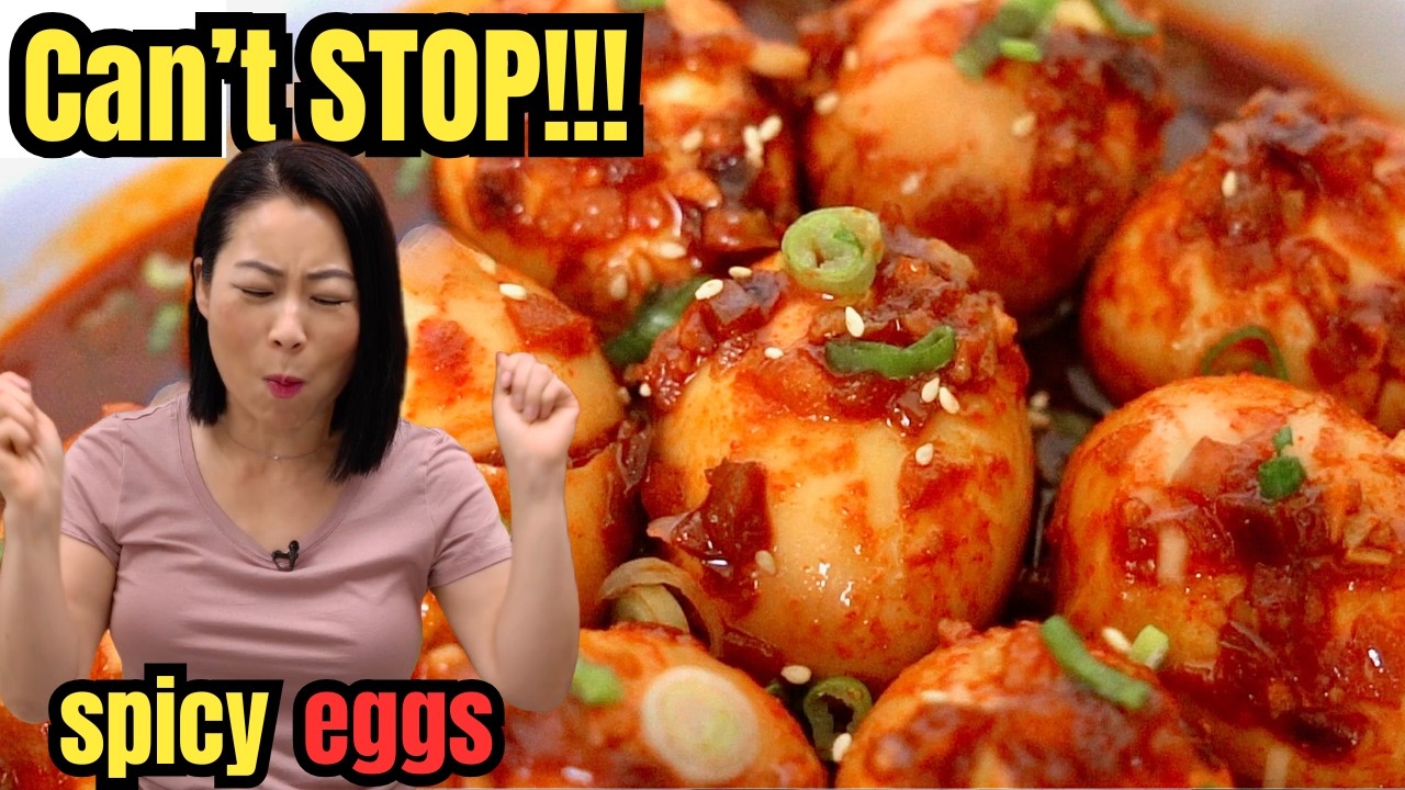 Spicy Braised Eggs (매콤한 달걀조림) in a rich Korean spicy soy sauce glaze, garnished with fresh scallions and sesame seeds, served as a traditional Korean side dish (Banchan).