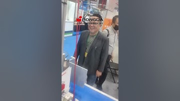 Paper bag handle rope inserting machine with tag inserting function