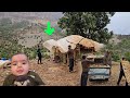"Delivery of the van in the hut to Saleh by Arslan and Sadiq's help in the heavy rain"