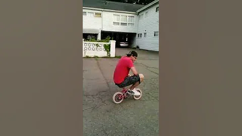 Me riding the smallest bike I can find